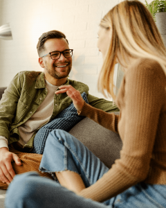 couple on couch talking couple on couch talking