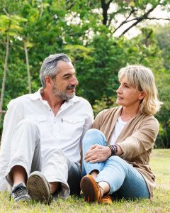 mature couple sitting outside talking mature couple sitting outside talking