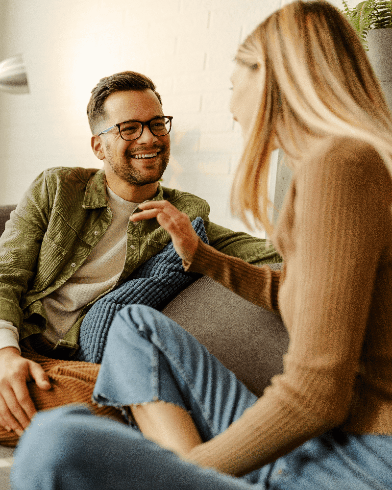 couple-on-couch-talking.png
